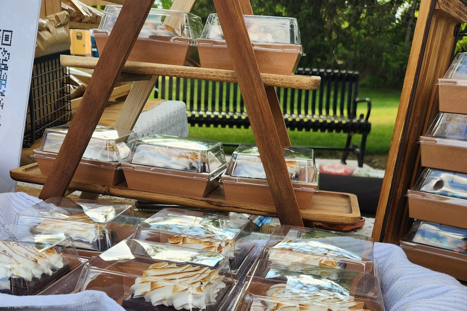 Boxed dessert treats up close on wooden rack